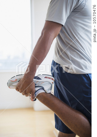 Athletic young man exercising at home Athletic young man exercising at home 10570476