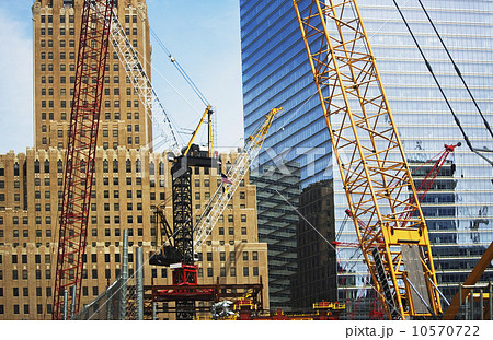 Cranes in front of buildings 10570722