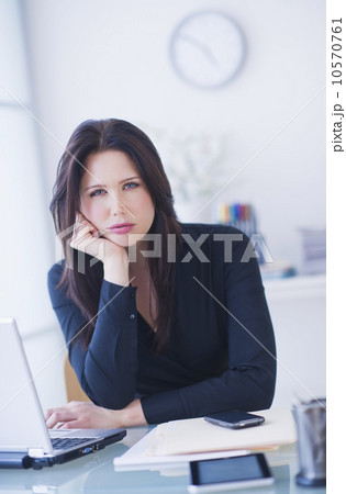 Portrait of businesswoman at desk 10570761