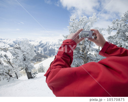 Man taking photograph, Wasatch Mountains, Utah, United States Man taking photograph, Wasatch Mountains, Utah, United States 10570875