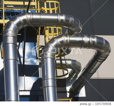 Metal ducts on outside of building 10570908