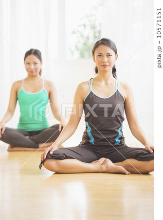 Two women on yoga class Two women on yoga class 10571151