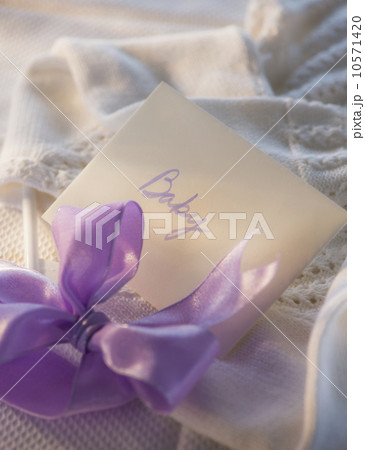 Close-up of envelope and purple bow Close-up of envelope and purple bow 10571420