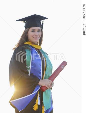 Portrait of graduate student holding diploma Portrait of graduate student holding diploma 10571470