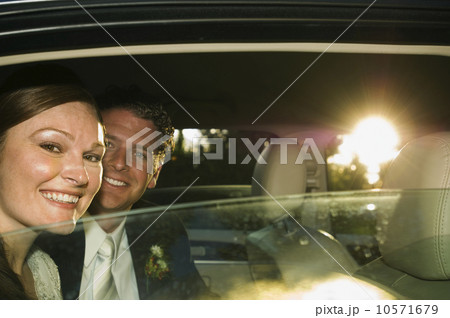 Bride and groom in limousine Bride and groom in limousine 10571679
