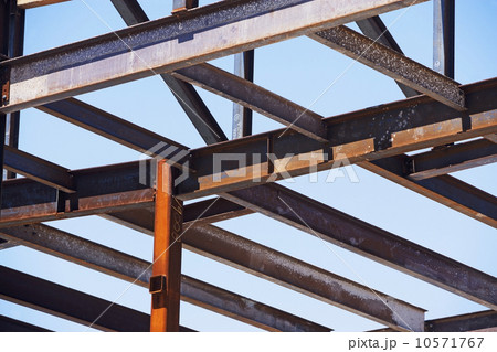 Low angle view of steel beams at construction site 10571767