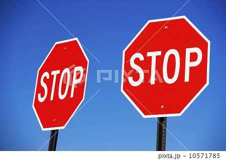 Two stop signs Two stop signs 10571785