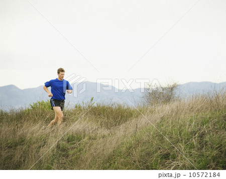 Person running on trail Person running on trail 10572184
