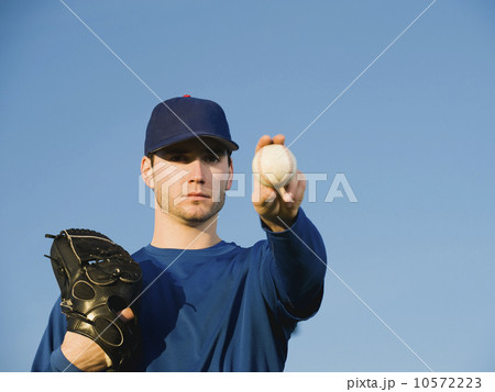 Baseball player holding ball 10572223
