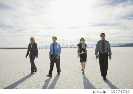 Businesspeople walking on salt flats, Salt Flats, Utah, United States Businesspeople walking on salt flats, Salt Flats, Utah, United States 10572710
