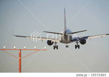 Commercial aeroplane taking off from runway 10572865