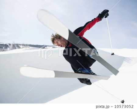 Skier jumping off lip of half-pipe Skier jumping off lip of half-pipe 10573052