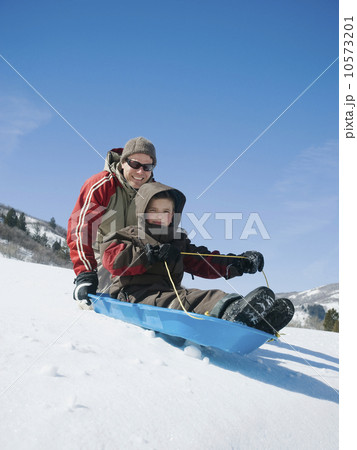 Father and son on sled Father and son on sled 10573201