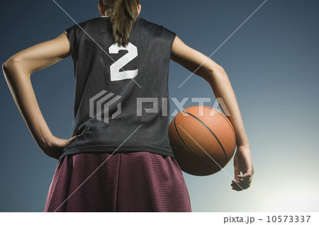 Girl holding basketball 10573337