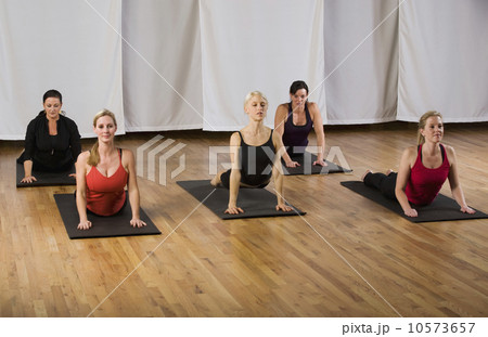 Woman exercising in yoga class 10573657