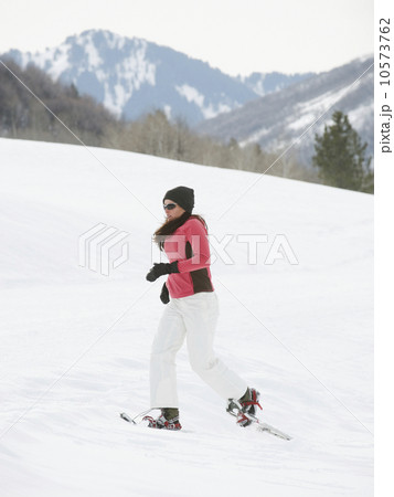 Woman snow shoeing Woman snow shoeing 10573762