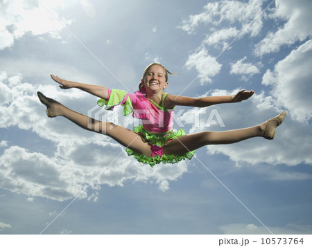 Low angle view of girl jumping Low angle view of girl jumping 10573764
