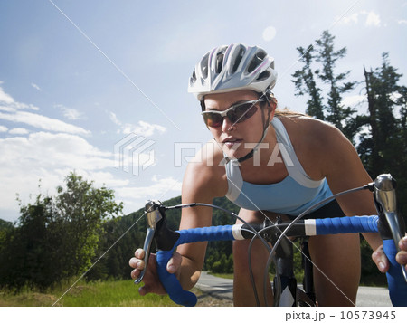 Cyclist on mountain road 10573945