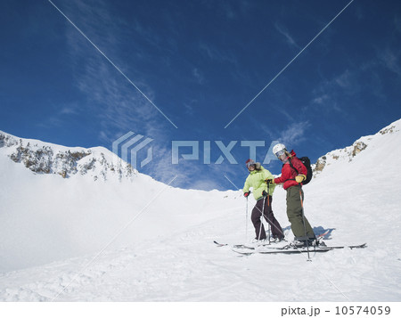 Women standing on skis 10574059