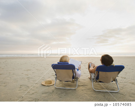 Couple relaxing at the beach Couple relaxing at the beach 10574085