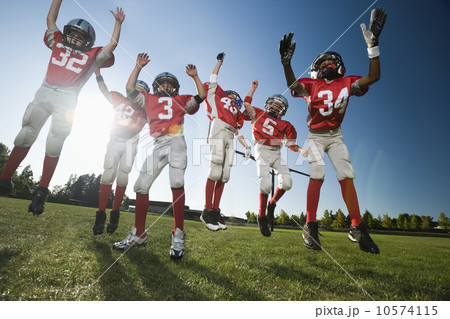 Football players celebrating on field 10574115