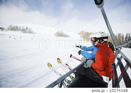 Skiers on a ski lift Skiers on a ski lift 10574198