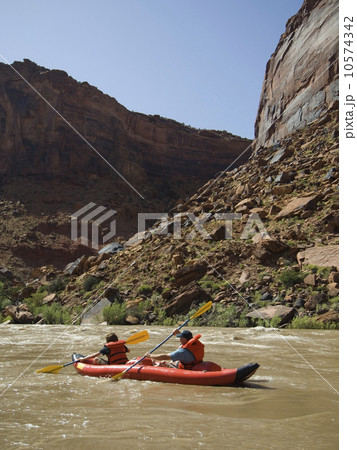 People paddling in raft People paddling in raft 10574342