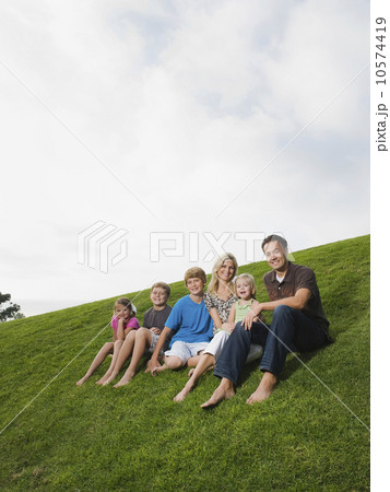 Family sitting on grass Family sitting on grass 10574419