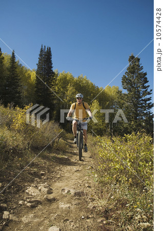 Man riding mountain bike, Utah, United States Man riding mountain bike, Utah, United States 10574428