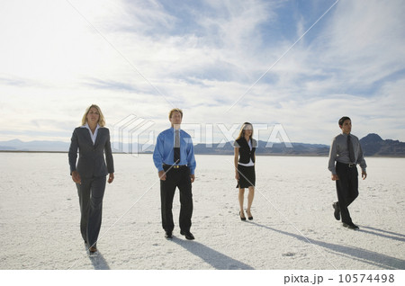 Businesspeople walking on salt flats, Salt Flats, Utah, United States Businesspeople walking on salt flats, Salt Flats, Utah, United States 10574498