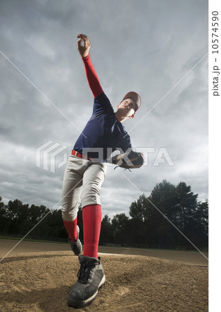 Baseball pitcher throwing ball 10574590