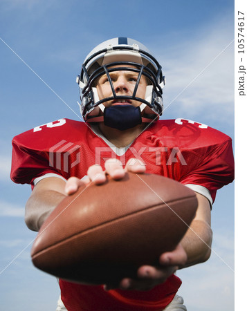 Quarterback holding football 10574617