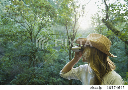 Hiker with binoculars Hiker with binoculars 10574645