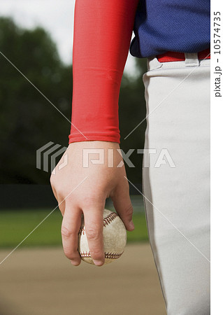 Baseball pitcher getting ready to throw ball 10574735