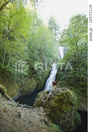 Hikers in front of waterfall Hikers in front of waterfall 10575116