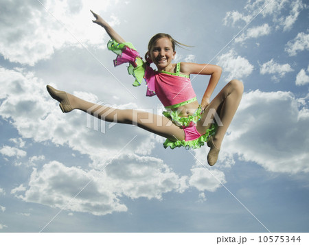 Low angle view of girl jumping 10575344