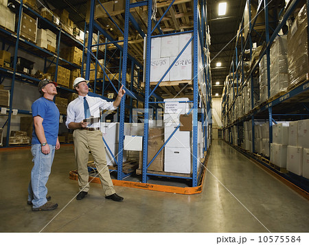 Warehouse workers checking inventory Warehouse workers checking inventory 10575584