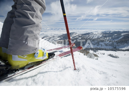 Close up of skier at top of mountain 10575596