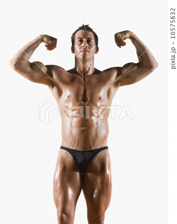 Male body builder flexing and posing 10575632