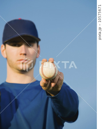 Baseball player holding ball 10575671
