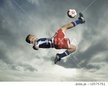Low angle view of soccer player jumping Low angle view of soccer player jumping 10575761