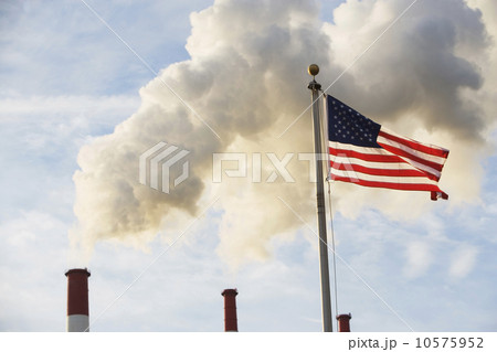 American flag in front of smoke stacks American flag in front of smoke stacks 10575952