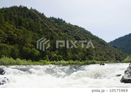 Whitewater raft approaching waterfall Whitewater raft approaching waterfall 10575969