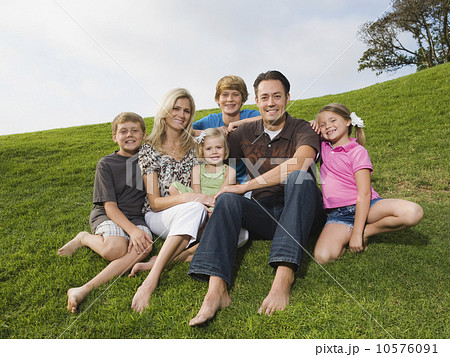 Family sitting on grass Family sitting on grass 10576091