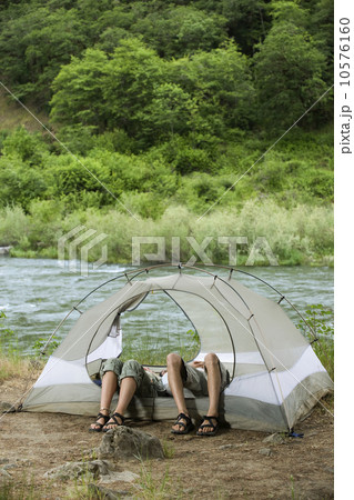 Couple relaxing in tent Couple relaxing in tent 10576160