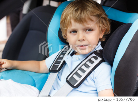 Little boy of 3 years sitting in safety car seat. Little boy of 3 years sitting in safety car seat. 10577700