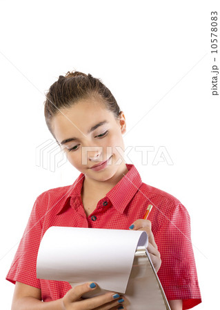 teenage girl writing on a pad, isolated on white teenage girl writing on a pad, isolated on white 10578083