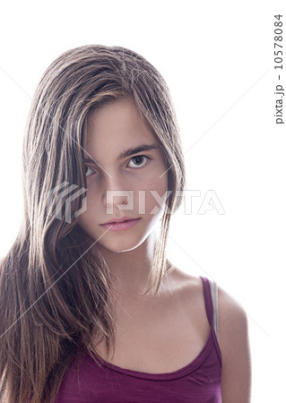 portrait of a serious female teenager with backlight, isolated o portrait of a serious female teenager with backlight, isolated o 10578084
