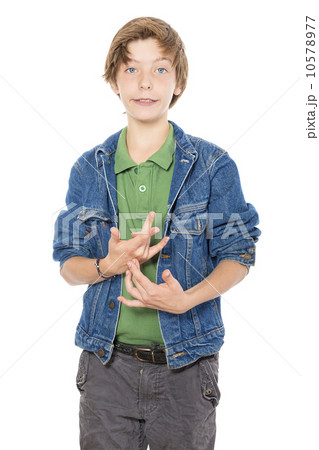 silly looking teenage boy makes gestures with his hands, isolate silly looking teenage boy makes gestures with his hands, isolate 10578977