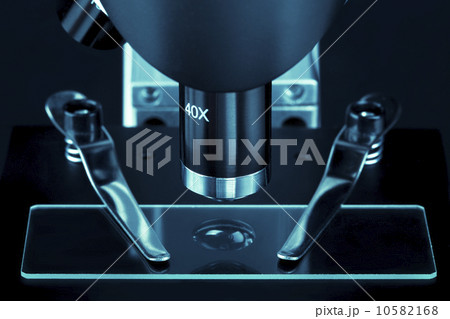 close up of a microscope slide with black background close up of a microscope slide with black background 10582168